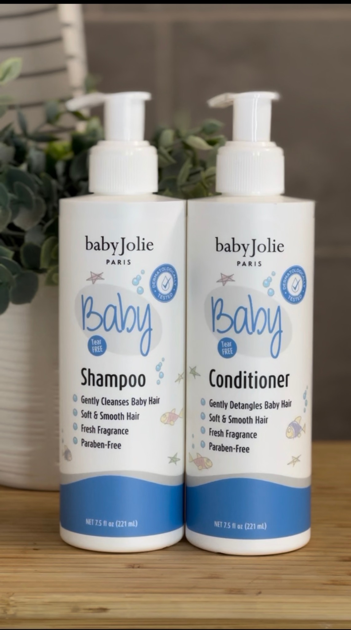 Baby Jolie shampoo and conditioner styled with greenery